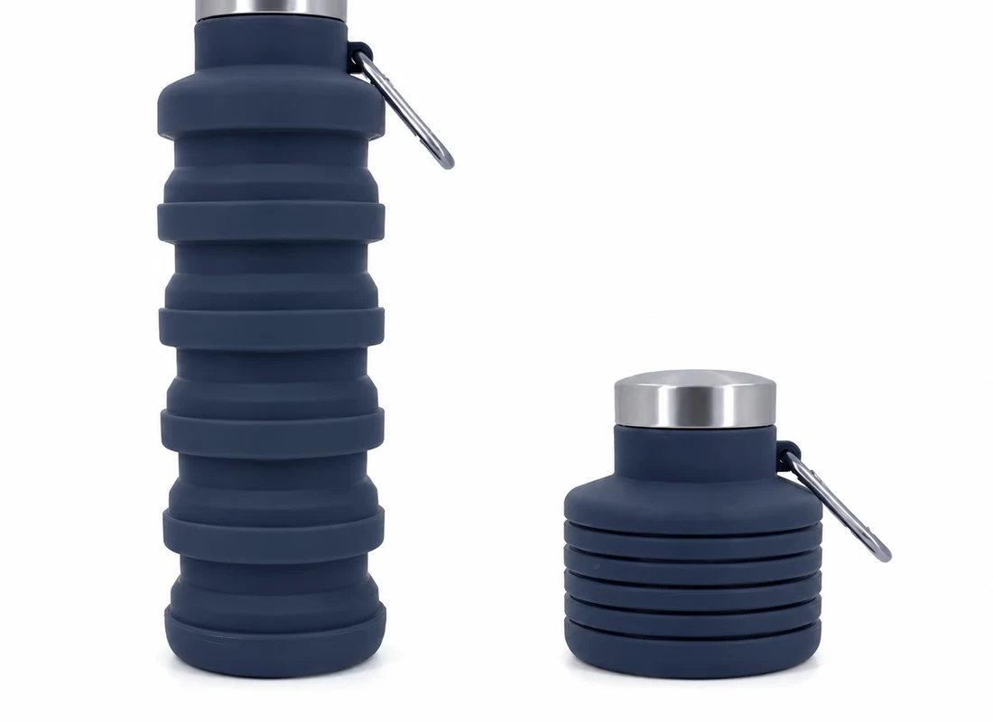 A navy Squishly collapsible bottle shown open at full height beside the same bottle folded down to a squat puck